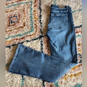 Women’s buckle black bootcut jeans